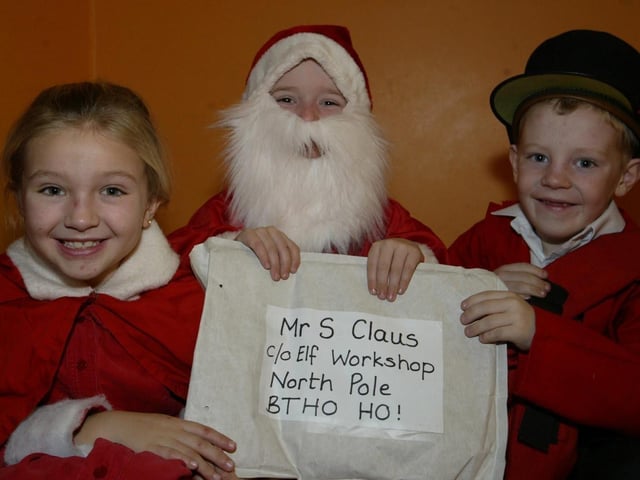 Model PS pupils Fiona Nelis, Zak Chester and Patrick Slevin who are the principal acotors in the schools nativity play "The Jolly Postman".  (0912JB08):Derry nativities and Christmas shows from December 2003