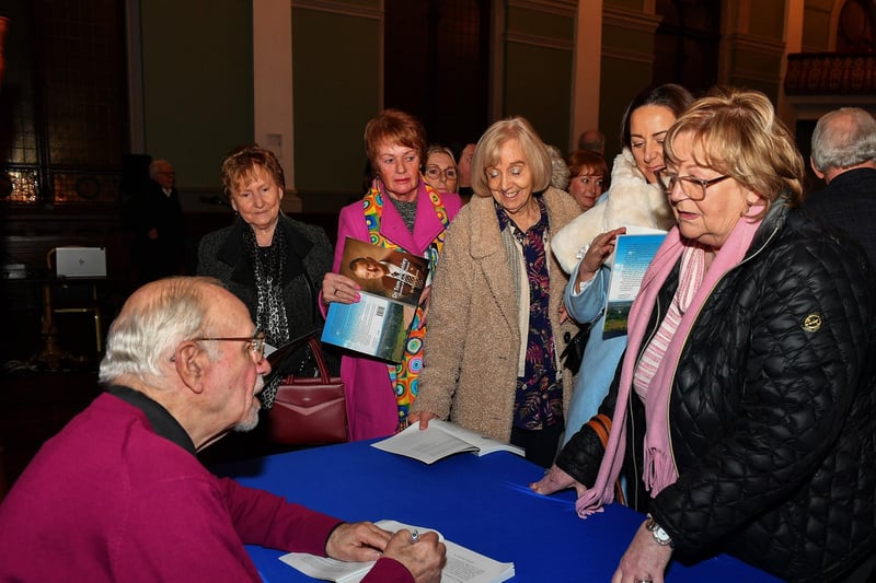 Dr Keith Munro signs copies of his new book on the life of Dr Tom McGinley, Foyle Hospice founder and palliative care pioneer, at St Columb’s Hall on Wednesday evening, Photo: George Sweeney