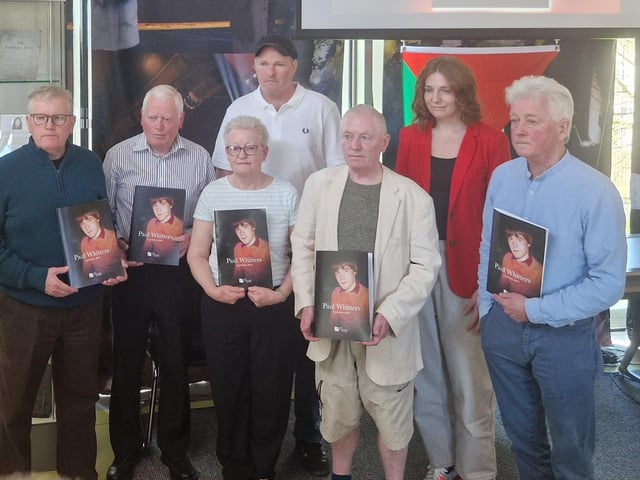 Front, from left, Stephen Brown (uncle), Tony Brown (uncle), Paul's mother, Helen Whitters, Gerard Brown (uncle) and Paul O'Connor, Pat Finucane Centre. Back, from left, Stuart Ross, PFC case worker, and Sara Duddy, formerly of PFC, both of whom produced the booklet.