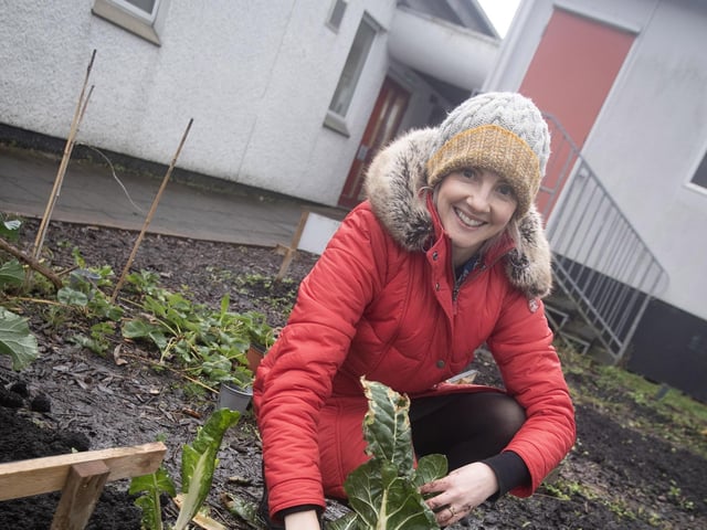 Hollybush Primary School teacher Helen Sutherland gets stuck in with some planting.