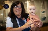 Derry Credit Union staff member Suzanne Cooley pictured with her granddaughter at Saturday's International Credit Union Day celebrations. (Photos: Jim McCafferty Photography) : .