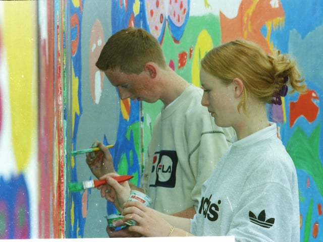 Young artists paint a mural during a fun day at Leafair.