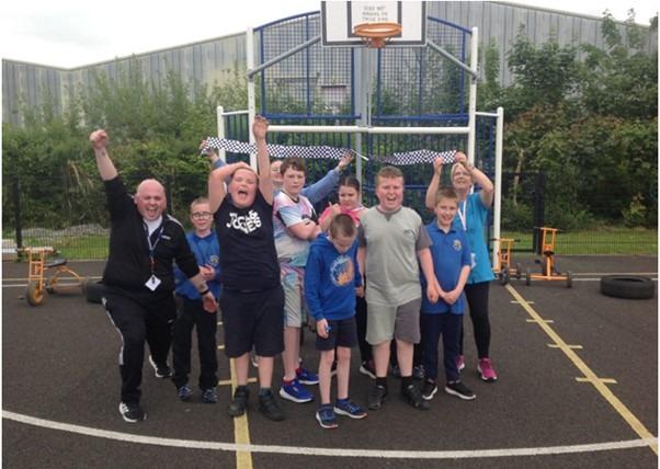 Knockavoe Primary School Class 7 pupils with Class Teacher David Loughrey on the left and Classroom Assistants Tierna-Kate Fox and Noelle Holmes at the rear.
