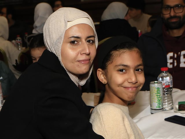Mother with her daughter at the “Taste of Ramadan” held in St. Columb’s Hall on Sunday. (Photo - Tom Heaney, nwpresspics)