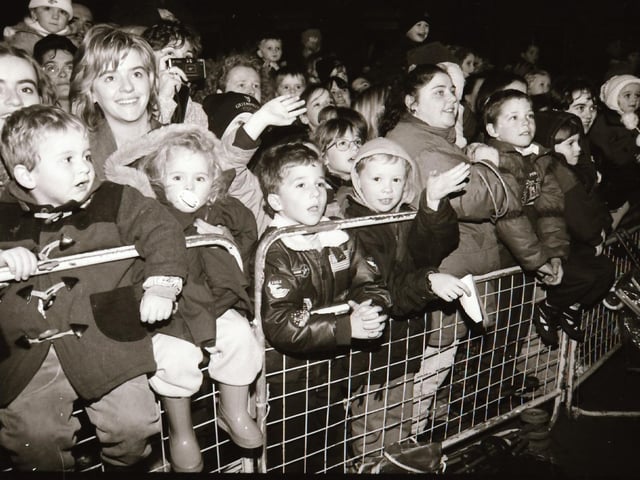 Crowds watch as Mayor and Mayoress of Derry, John and Carita Kerr switch on the Christmas lights with a little help from Spider Man and the Power Rangers.
