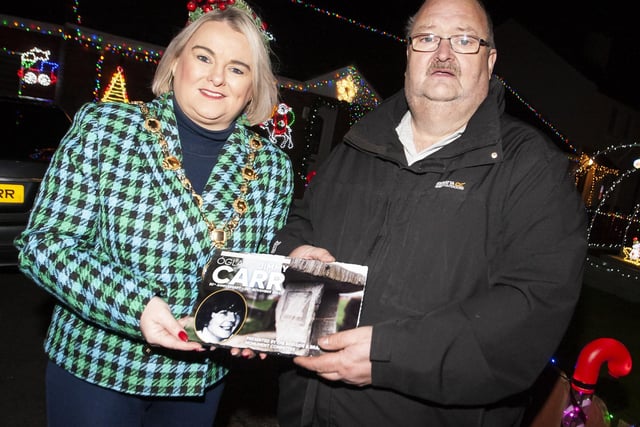 The Mayor, Sandra Duffy pictured with Martin Carr and a plaque of his late brother Jimmy, who died 50 years ago last month. It was presented to him by the Bogside and Brandywell Monument Committee.