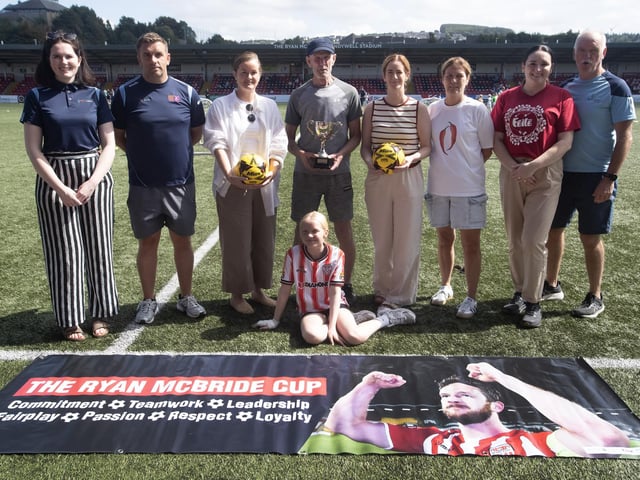 RYAN McBRIDE CUP 2025. . .Group pictured at the Ryan McBride Brandywell Stadium on a sunny Thursday afternoon for the start of the Feile's Annual Ryan McBride Cup. From left, Ciara McElhinney, BBHF, Mo Mahon, tournament organiser, Colleen mcCann, Ryan's sister, Lexie McBride, Ryan's father, Siunin McBride, Gina McBride, Ryan's sisters, Aisling Hutton and George Harkin, BBHF. (Photos: Jim McCafferty Photography)