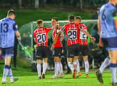 Derry City's Jordan McEneff is congratulated by team-mates Brandon Kavanagh (20), Cian Kavanagh (29) and Ronan Boyce after scoring the opening goal at UCD.