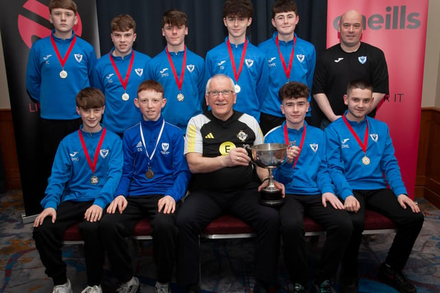 Joe Doherty, IFA Senior Coach, presenting the 2008 Rambo Gillespie Cup to Oxford United FC, at the Annual Awards in the City Hotel on Friday night last. Included is coach Ronan Kelly. ({Photo: Jim McCafferty)