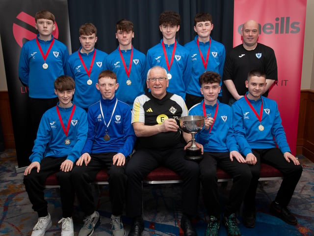 Joe Doherty, IFA Senior Coach, presenting the 2008 Rambo Gillespie Cup to Oxford United FC, at the Annual Awards in the City Hotel on Friday night last. Included is coach Ronan Kelly. ({Photo: Jim McCafferty)