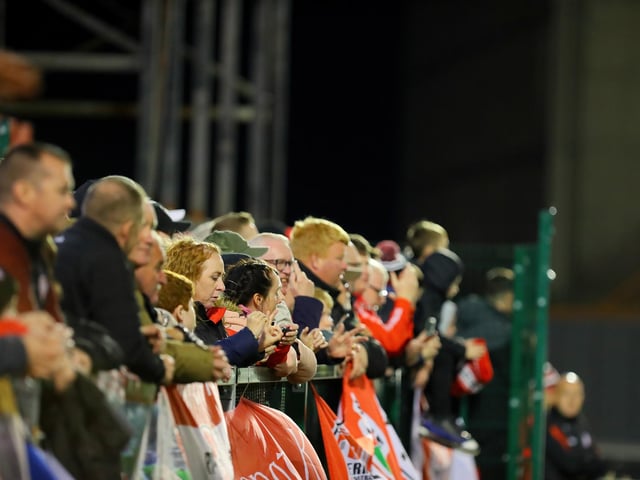 Derry City fans watch on from the Mono Stand at Dalymount Park.