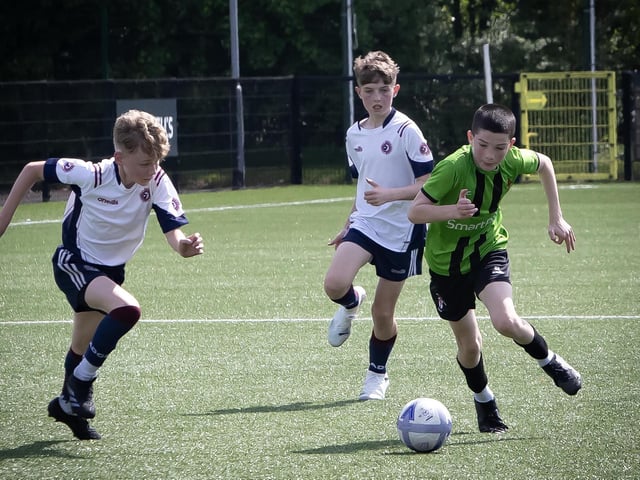 St. Joseph's striker Liam Gallagher storms away from his markers during Thursday's final.