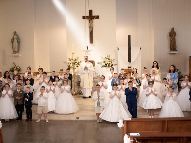 Pupils from Holy Child Primary School who received the Sacrament of First Holy Communion from Fr. Ignacy Saniuta, CC at St. Mary's Church, Creggan on Friday last. (Photo: Kerrie Quinn)