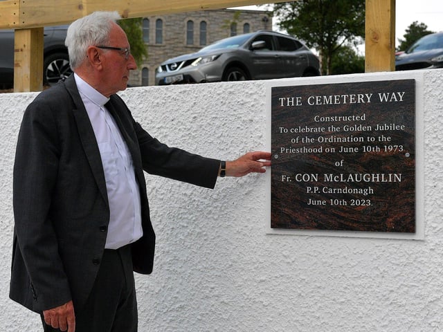 Fr Con McLaughlin PP, pictured alongside a plaque, erected by parishioners, in the grounds of the Church of the Sacred Heart, Carndonagh, on Saturday evening, to mark the occasion of his Golden Jubilee in the priesthood. Photo: George Sweeney. DER2323GS – 169