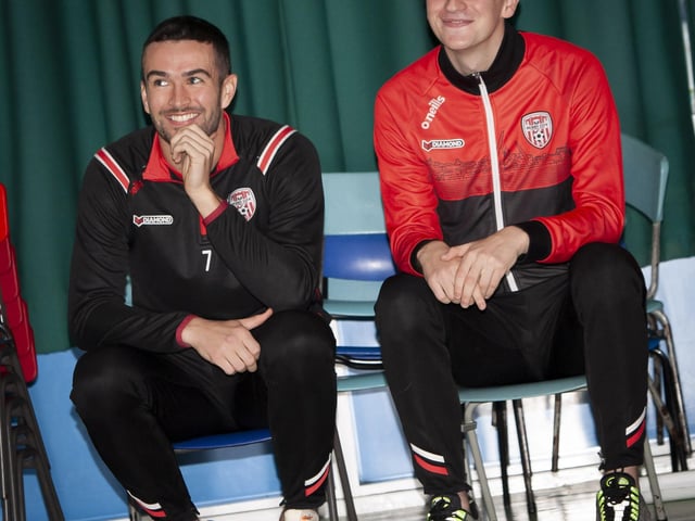 Derry players Michael Duffy and Caoimhin Porter enjoying the P7 ‘Don’t Stop Us Now!’ video re-run during their visit on Monday.