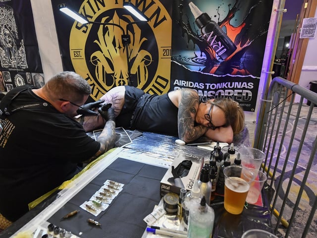 Tattoo artists at the annual Maiden City Ink International Tattoo Convention held in the Everglades Hotel. Photo: George Sweeney