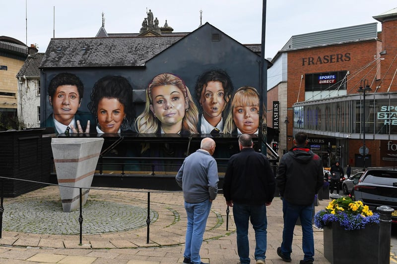 The Derry Girls Mural, on Orchard Street, with recently added pub awning. Photo: George Sweeney