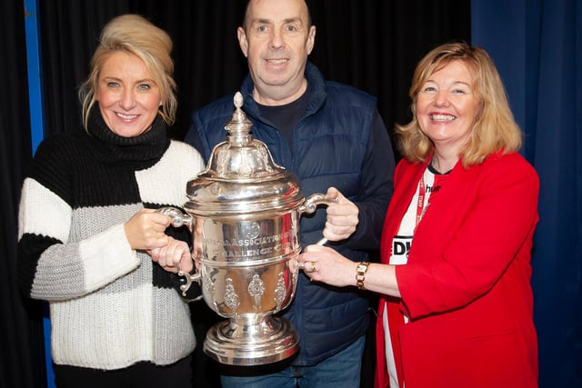Steelstown Primary School teachers Miss McElhinney, Mr Duffy and Mrs Gillen pictured with the FAI Cup this week. (Photo: Jim McCafferty)