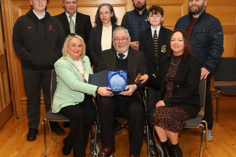 Mayor Sandra Duffy making a presentation to sculptor Maurice Harron, in recognition of his contribution as an art educator and artist in the City and District at a civic reception held in the Guildhall. Included are his children and grandchildren.  (Photo - Tom Heaney, nwpresspics)