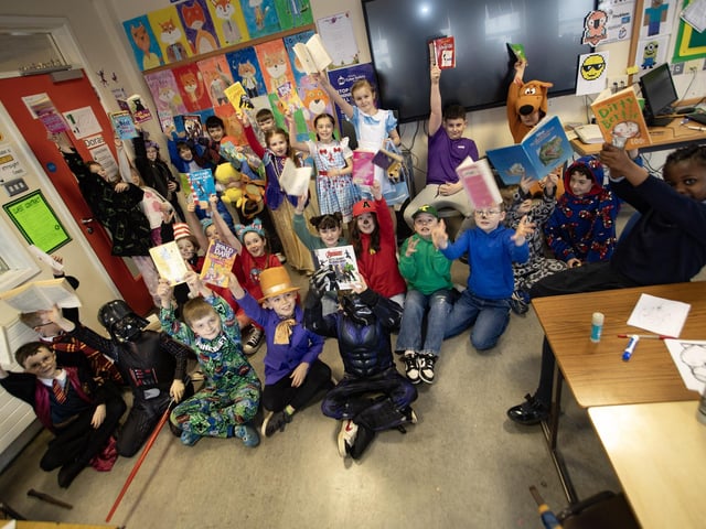 Mrs. Matthews and Mrs. McGurran's P5 classes celebrate World Book Day 'Hollybush-Style' on Thursday.
