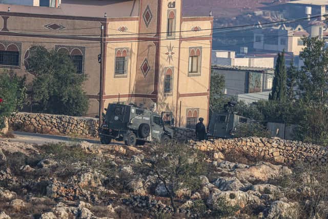 Israeli soliders gather during a military operation after a Palestinian man barricaded himself inside a home in the Israel-occupied West Bank village of Aqraba, south of the city of Nablus on September 8, 2026. Israeli forces shot dead a Palestinian man in Aqraba the occupied West Bank on September 8, the Palestinian health ministry said, while the military said it killed a suspect who had attempted to attack troops. The Palestinian health ministry announced the death of 28-year-old Abdul Karim Muhammad Khader Suleiman, who it said was "shot and killed by the occupation forces on Tuesday morning in the town of Aqraba". (Photo by JAAFAR ASHTIYEH / AFP via Getty Images)