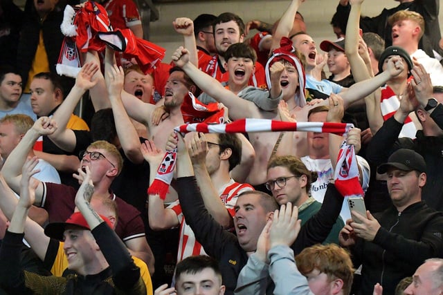 Fans celebrate Derry City’s win over KuPs at the Brandywell. Photo: George Sweeney. DER2330GS -