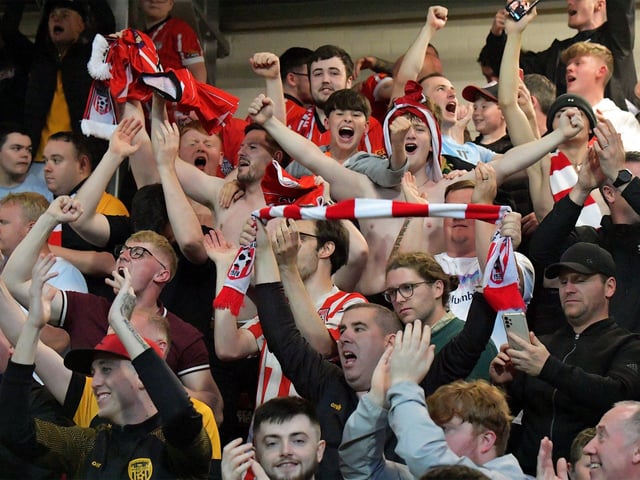Fans celebrate Derry City’s win over KuPs at the Brandywell. Photo: George Sweeney. DER2330GS -