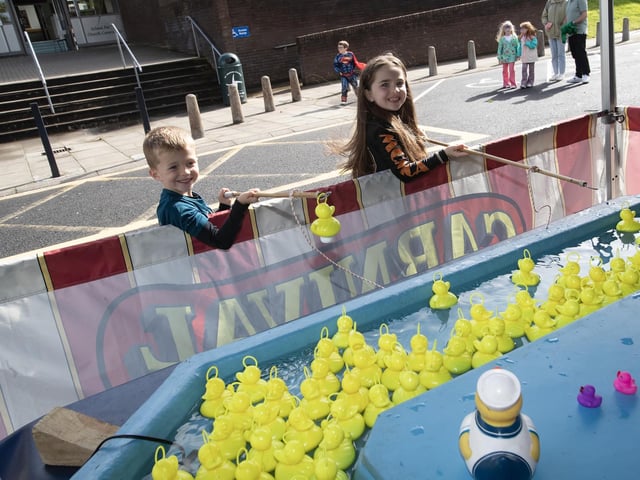 DUCK CATCHING!. . . .Brother and sister Theo and Ria catching some ducks during Saturday's GSAP End of Summer Festival. (Photos: Jim McCafferty Photography)