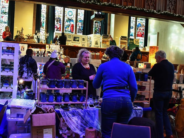 People browse the large range of gifts at the Guildhall Christmas Fair on Friday afternoon. Photo: George Sweeney / Derry Journal