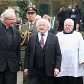 2017: Irish President Michael D Higgins with the Bishop of Derry Dr Donal McKeown the funeral of Martin McGuinness, at St Columba's Church Long Tower. Niall Carson/PA Wire