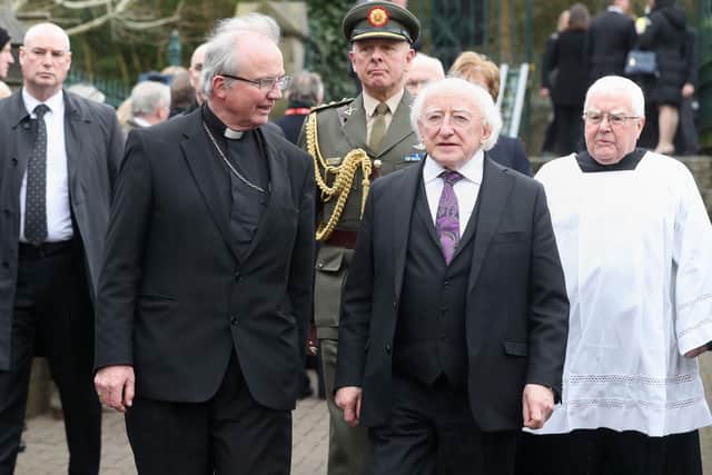 2017: Irish President Michael D Higgins with the Bishop of Derry Dr Donal McKeown the funeral of Martin McGuinness, at St Columba's Church Long Tower. Niall Carson/PA Wire