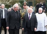 2017: Irish President Michael D Higgins with the Bishop of Derry Dr Donal McKeown the funeral of Martin McGuinness, at St Columba's Church Long Tower. Niall Carson/PA Wire
