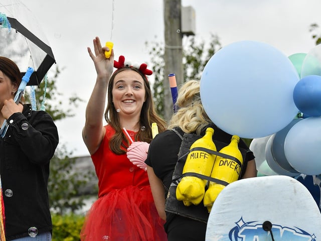 Muff Feile opening parade makes its way through the village on Friday evening. Photo: George Sweeney