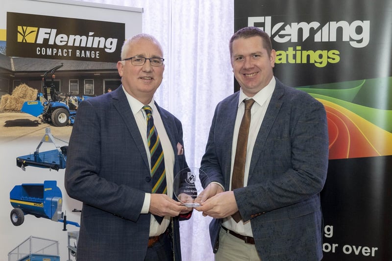 Jordan McGonigle of Donemana  receives his 'Outstanding Contribution to Cricket' award from Brian Dougherty