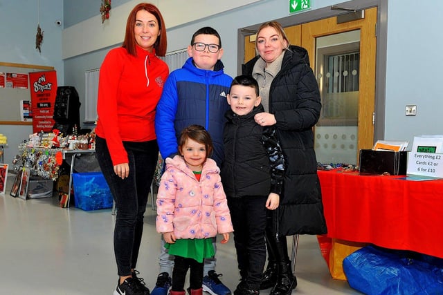 Karen O’Doherty, Ruth Johnson, Aaron, John and Jessica pictured at the Christmas Craft Fair held in the Galliagh Community Centre on Saturday afternoon. Photo: George Sweeney. DER2250GS – 82