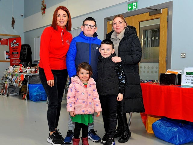 Karen O’Doherty, Ruth Johnson, Aaron, John and Jessica pictured at the Christmas Craft Fair held in the Galliagh Community Centre on Saturday afternoon. Photo: George Sweeney. DER2250GS – 82