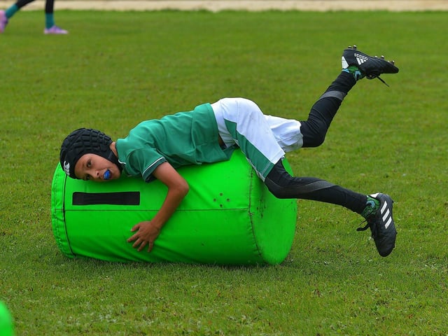 Young participant develops his tackling skills at the recent City of Derry Youth Rugby Summer Camp. Photo: George Sweeney. DER2331GS – 54