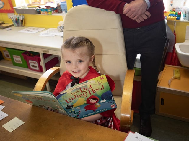 Little Red Riding Hood (aka P2 pupil Ava) gets the thumbs up for reading from Principal Mr. Feargal Friel on Thursday.