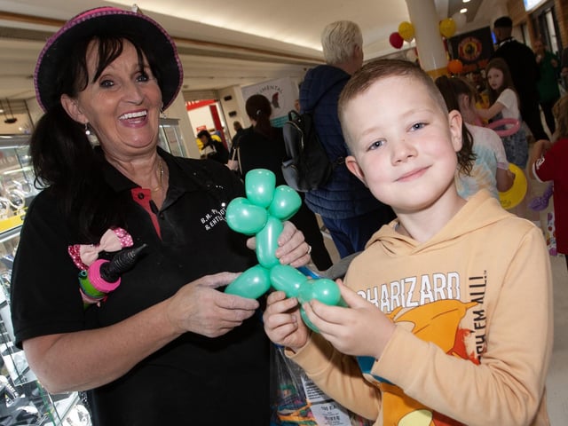 Balloon Lady Kate Carlyle pictured with 8 years-old Callum Campbell at the Lisnagelvin Shopping Centre's Annual Great Family Fun Day in aid of charities Cancer Fund for Children and ME4 Mental Health Support and Suicide Prevention.