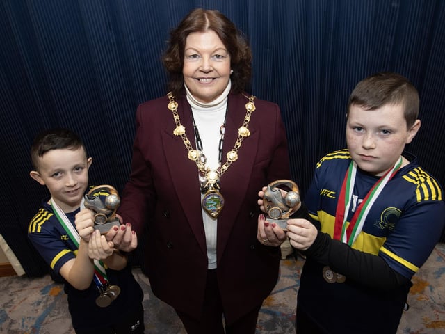 The Mayor, Patricia Logue presenting Players of the Year awards to Charlie Rafferty and Damien Meehan, Don Boscos FC at Friday night's D&D Youth FA presentations.