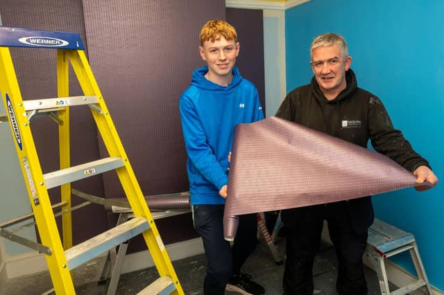 Cormac McVeigh finds out about Painting and Decorating courses at NWRC Springtown from Sean Barton, lecturer.