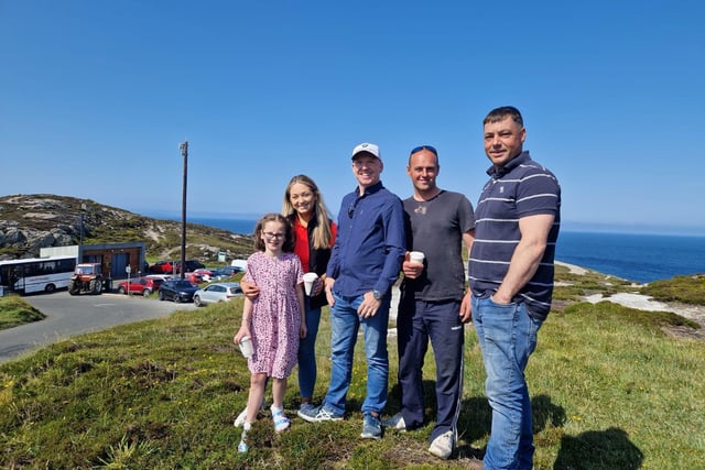 Participants gathering under blue skies for the Inish Tractor Run.