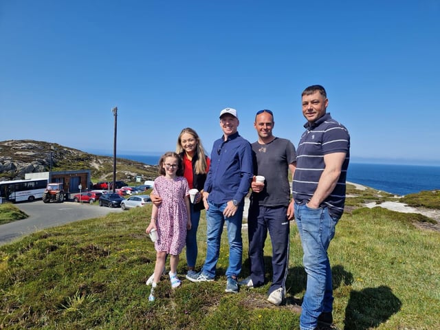 Participants gathering under blue skies for the Inish Tractor Run.