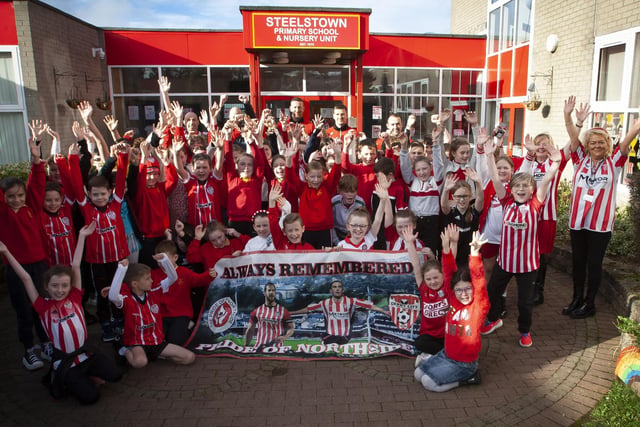 Pupils and staff of Steelstown Primary School welcome Derry City players Shane and Patrick McEleney and Michael Duffy to the school ahead of Sunday's FAI Cup final. (Photo: Jim McCafferty)
