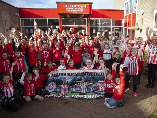 Pupils and staff of Steelstown Primary School welcome Derry City players Shane and Patrick McEleney and Michael Duffy to the school ahead of Sunday's FAI Cup final. (Photo: Jim McCafferty)
