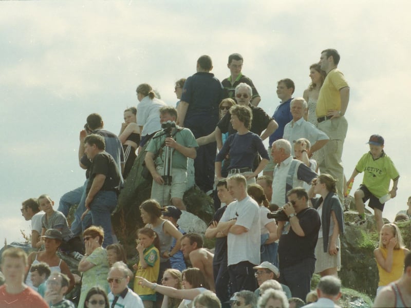 People gather on the quayside to view the Moville raft race.