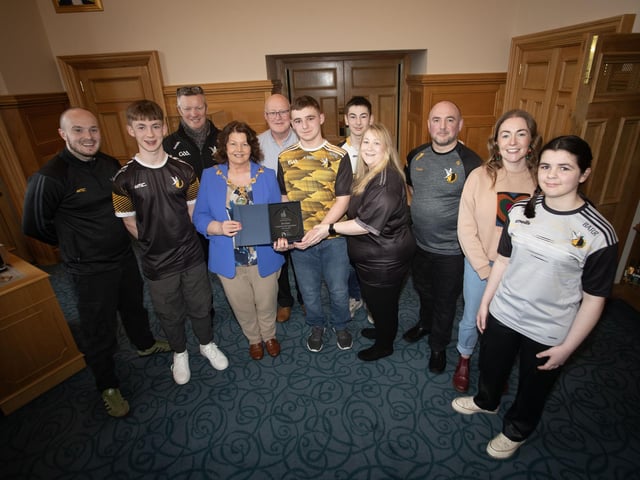 The Mayor of Derry City and Strabane District Council, Patricia Logue pictured presenting Oisin Barr with recognition of his achievement of being Translink Ulster GAA Young Volunteer of the Year 2023, at a reception in his honour in the Guildhall on Wednesday evening. Included are family members and Doire Colmcille club representatives.