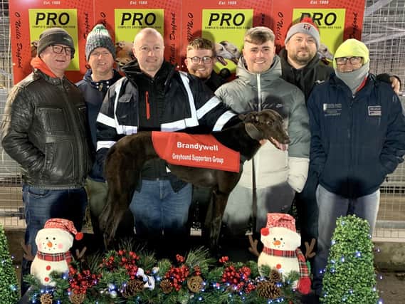 'Putthetaeon' won the Brandywell Greyhound Supporters Group Sprint in 16.74 for owner Ethan Tyre. From left to right, Ethan and Brendan Tyre, Paul McFadden, Colin and Sean Tyre, Kevin Canning and Patsy Doyle.