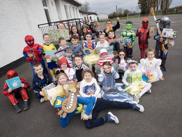 Happy children celebrating World Book Day at Hollybush PS on Thursday.