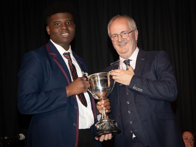 David Lawal pictured with Principal Mr Harkin. David received curriculum awards for Design & Technology, Geography, Maths Double Award Science, Religious Education and Overall Academic Excellence.